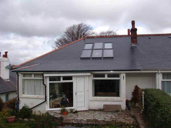 House with a new bank of roof windows after a loft conversion