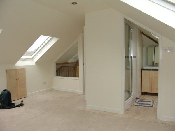 Finished loft room with a roof window and shower room